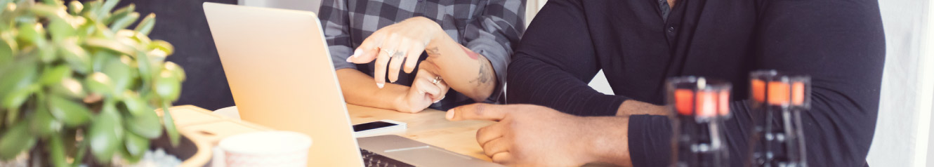 two people looking at a computer